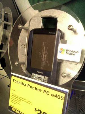 A Toshiba e405 Pocket PC in a retail display case